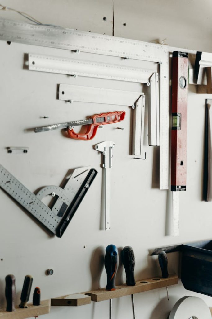 Organized wall-mounted carpentry tools in a workshop setting.